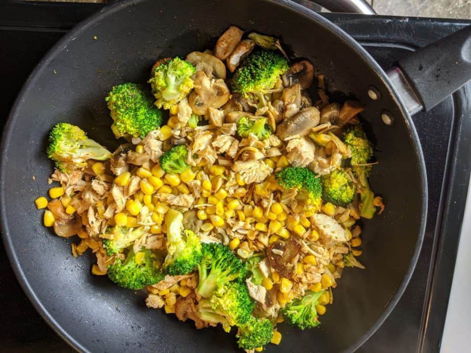 Broccoli Chicken and wild rice in a skillet on the stove