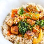 Sesame Tempeh stir fry on a white plate