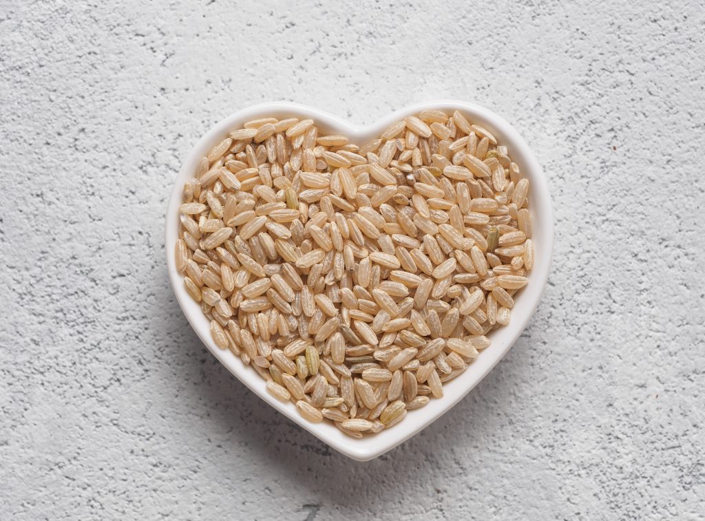 Brown rice in a heart shaped bowl