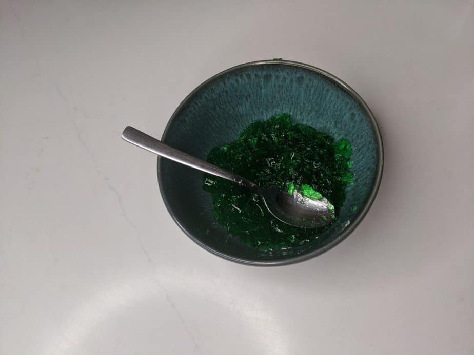 bowl with green jello and a spoon