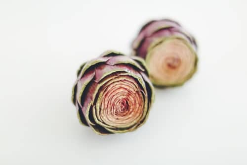Purple and green cabbage, sliced in half