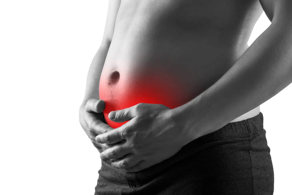 Fat man with bloating and abdominal pain, overweight male body isolated on white background, painful area highlighted in red