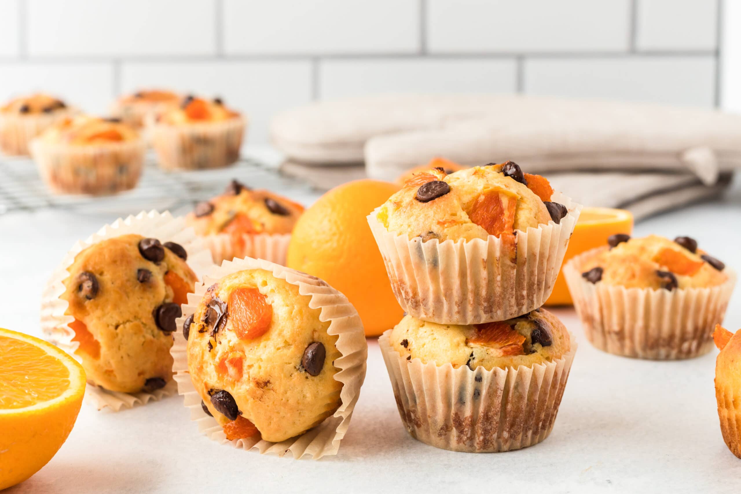 Low point Orange breakfast muffins on a white table.