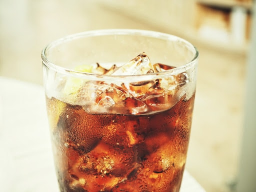 Cola with ice cubes