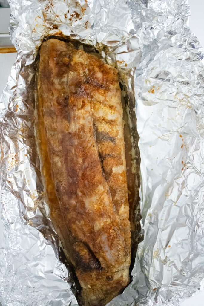 oven cooked baby back rib with foil open