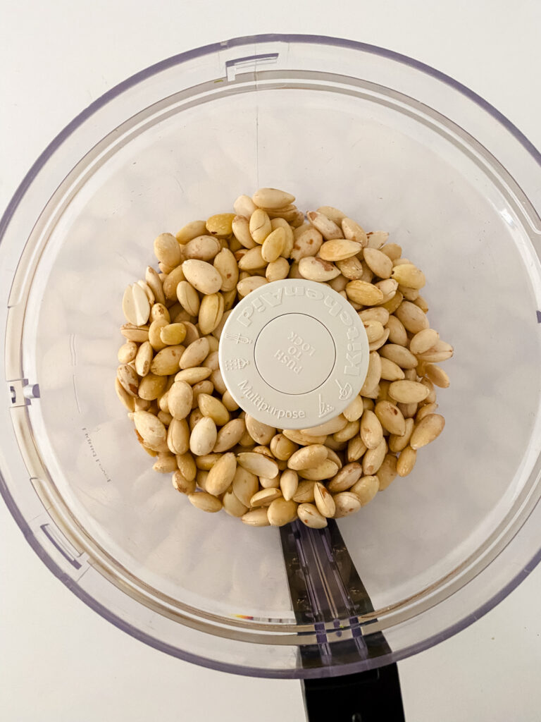 peeled almonds inside food processor