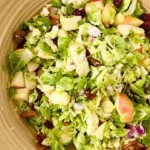 brussels sprout salad with maple dressing in bowl