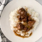 stew meat gravy poured on rice