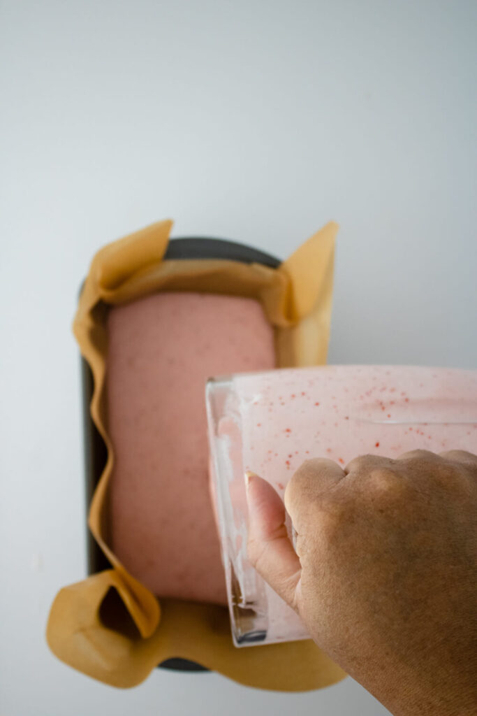 strawberry puree poured inside the loaf pan