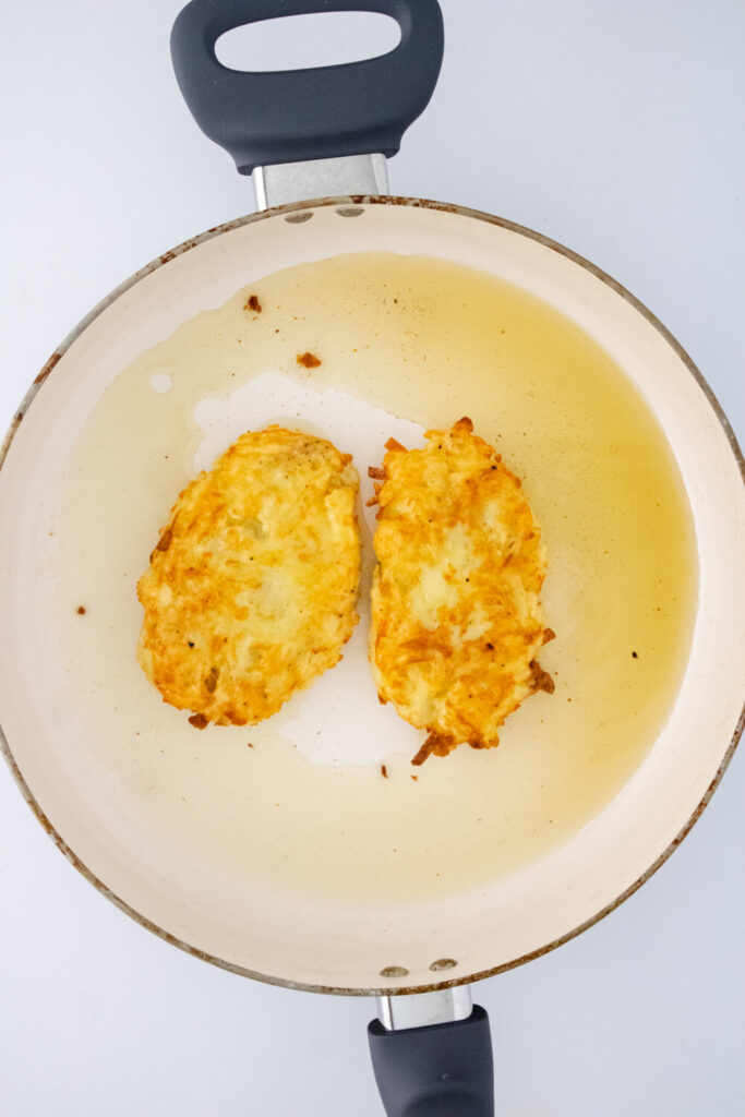 golden brown homemade hashbrowns in the frying pan