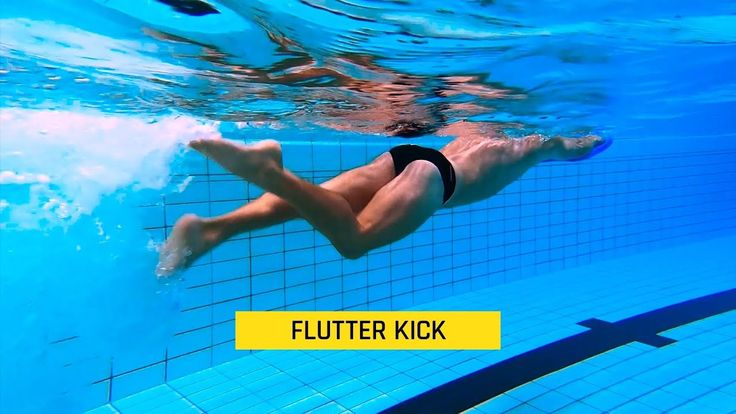 a swimmer performing the flutter kick underwater