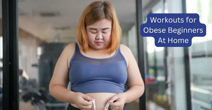 An obese woman stands indoors, looking down as she holds a measuring tape around her waist.